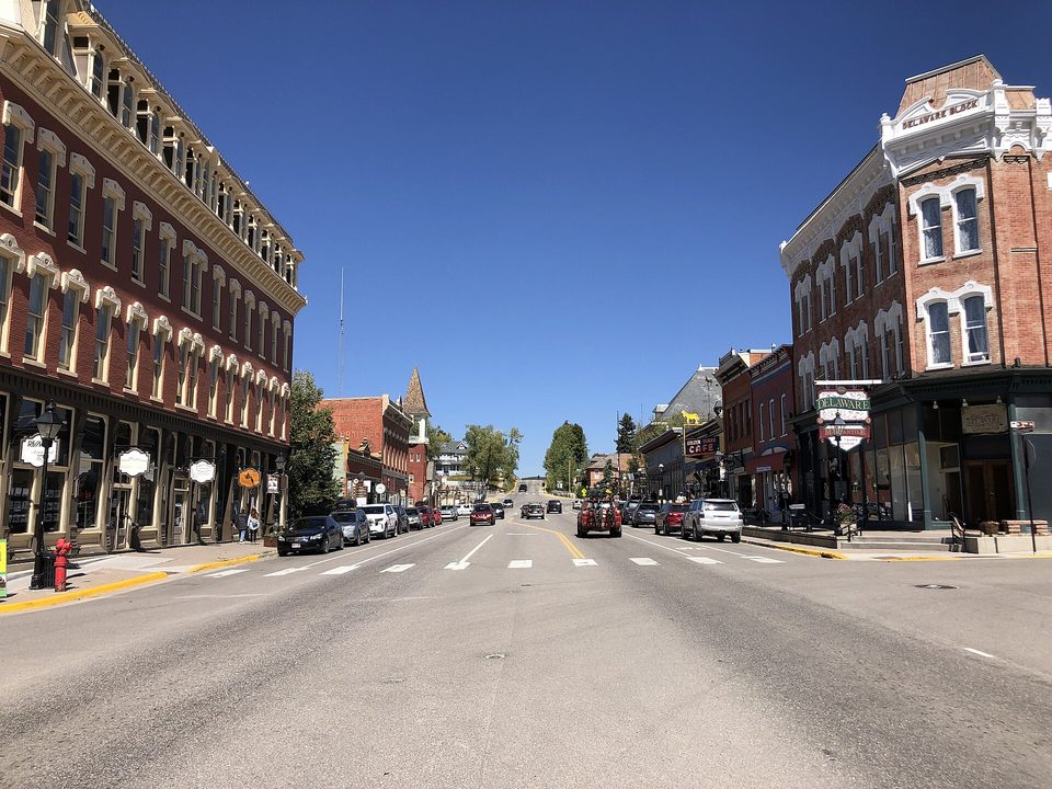 Leadville's Harrison Avenue with brick Victorian storefronts and the Delaware Block