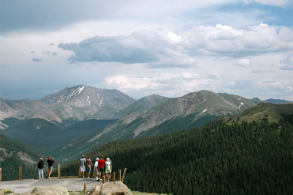 Visitors at the Independence Pass overlook with the Sawatch peaks stretching away