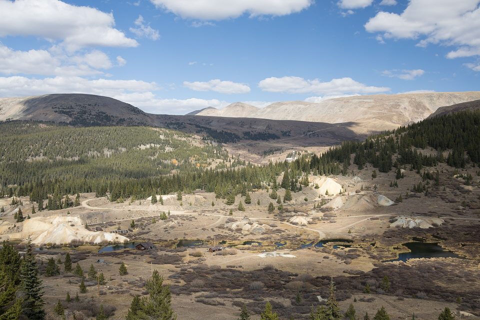 Looking down on old mine dumps and cabins in a high valley below Mosquito Pass