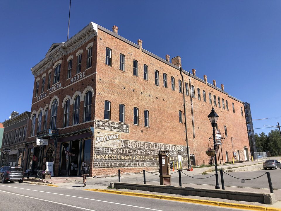 The Tabor Opera House, a red-trimmed brick building with an American flag